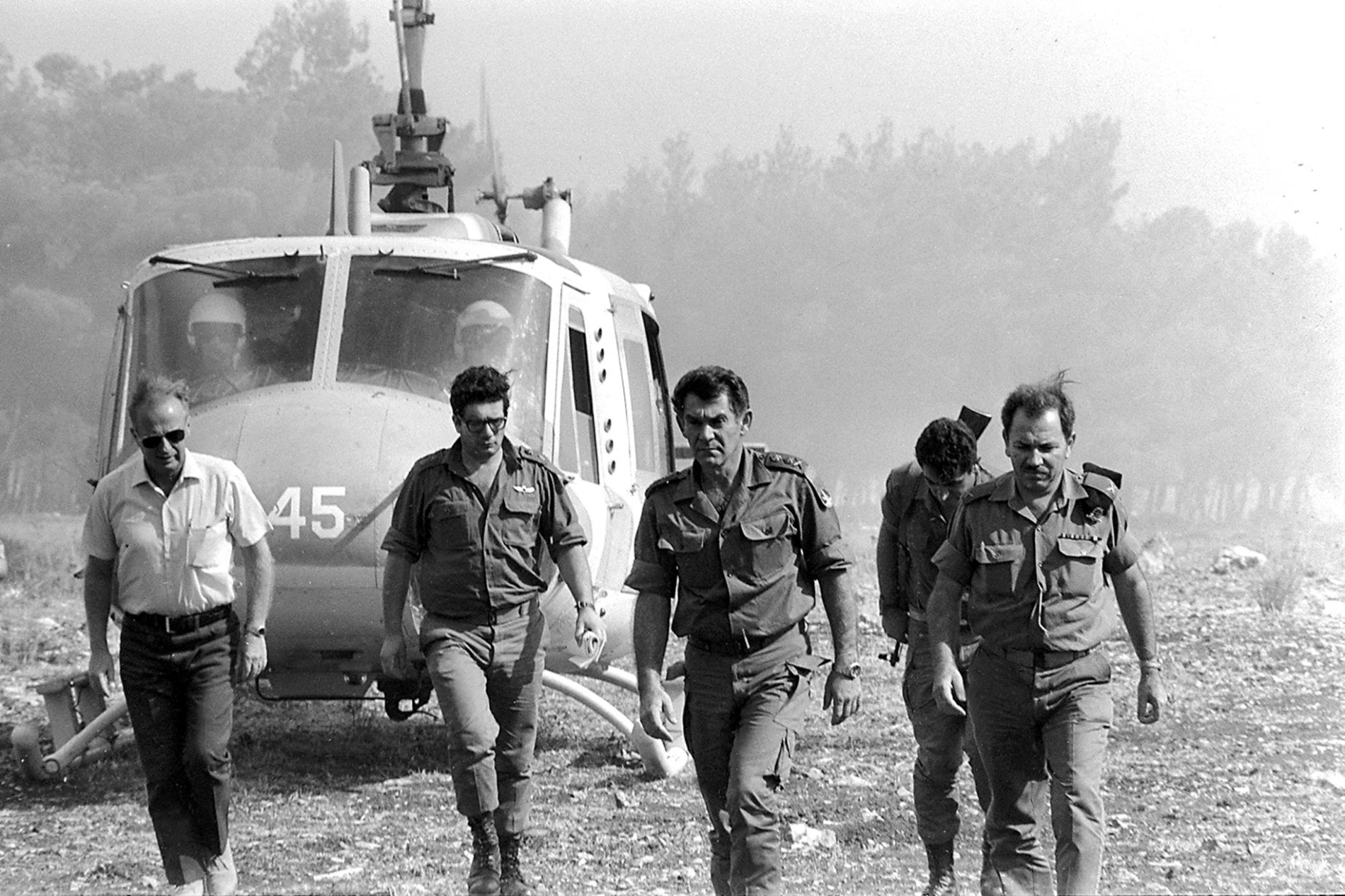 Israeli Chief of Staff David Elazar (2nd R) and later Israeli Premier Yitzhak Rabin (L) land near frontline positions on the Golan Heights during the 1973 October War on October 9, 1973.