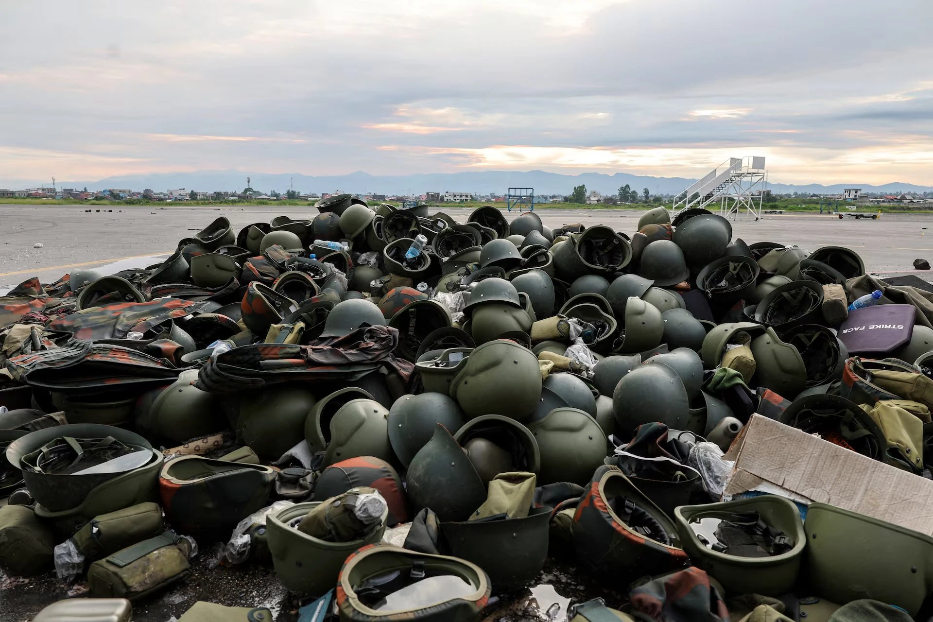 Helmets abandoned by Congo's military lay in a pile at the Goma airport on March 19, 2025. Congolese forces fled the city in January, overrun by M23 rebels. REUTERS/Zohra Bensemra