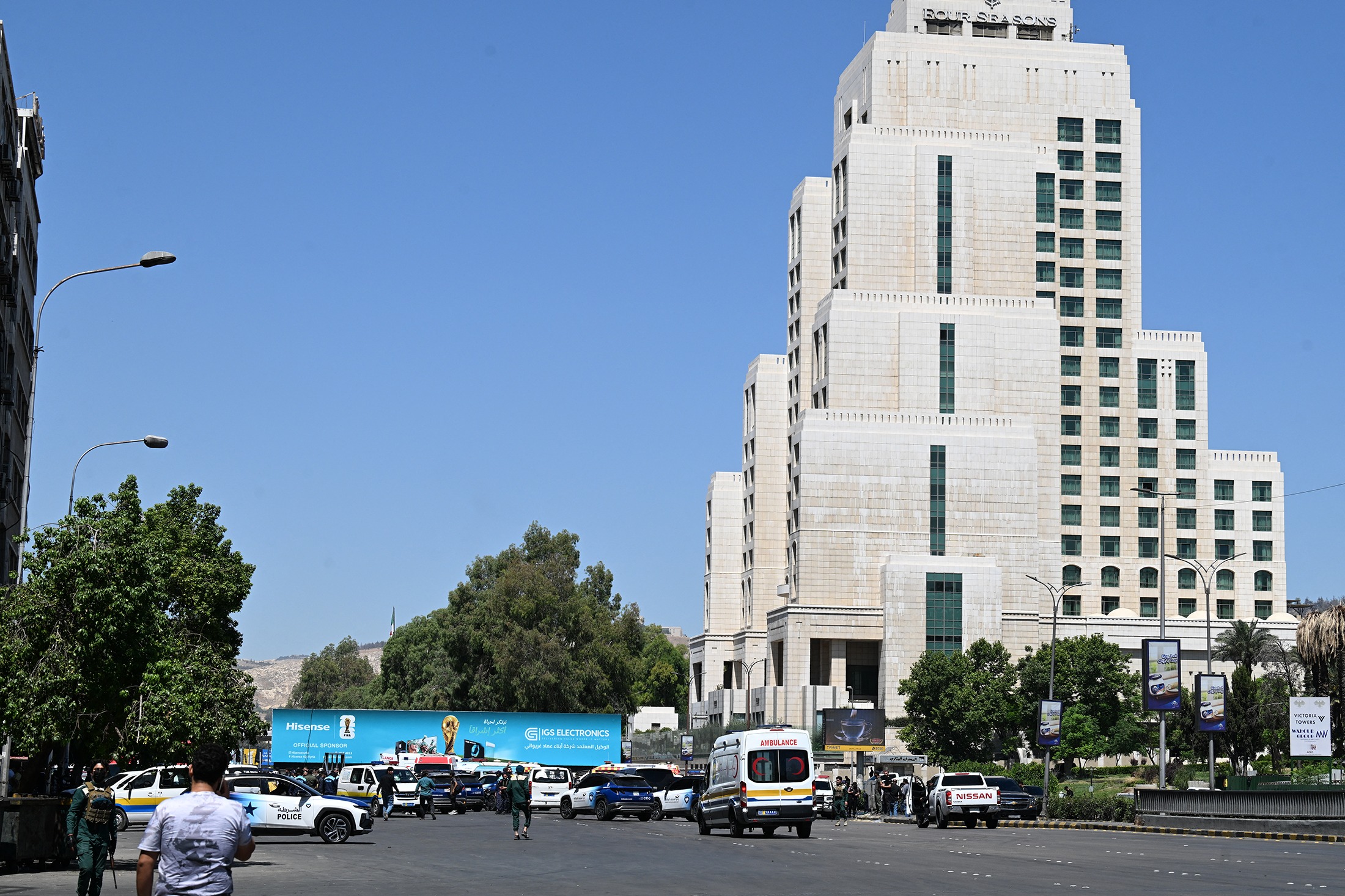 Syrian police and emergency personnel near Four Seasons Hotel in Damascus, July 7, 2026 - AFP