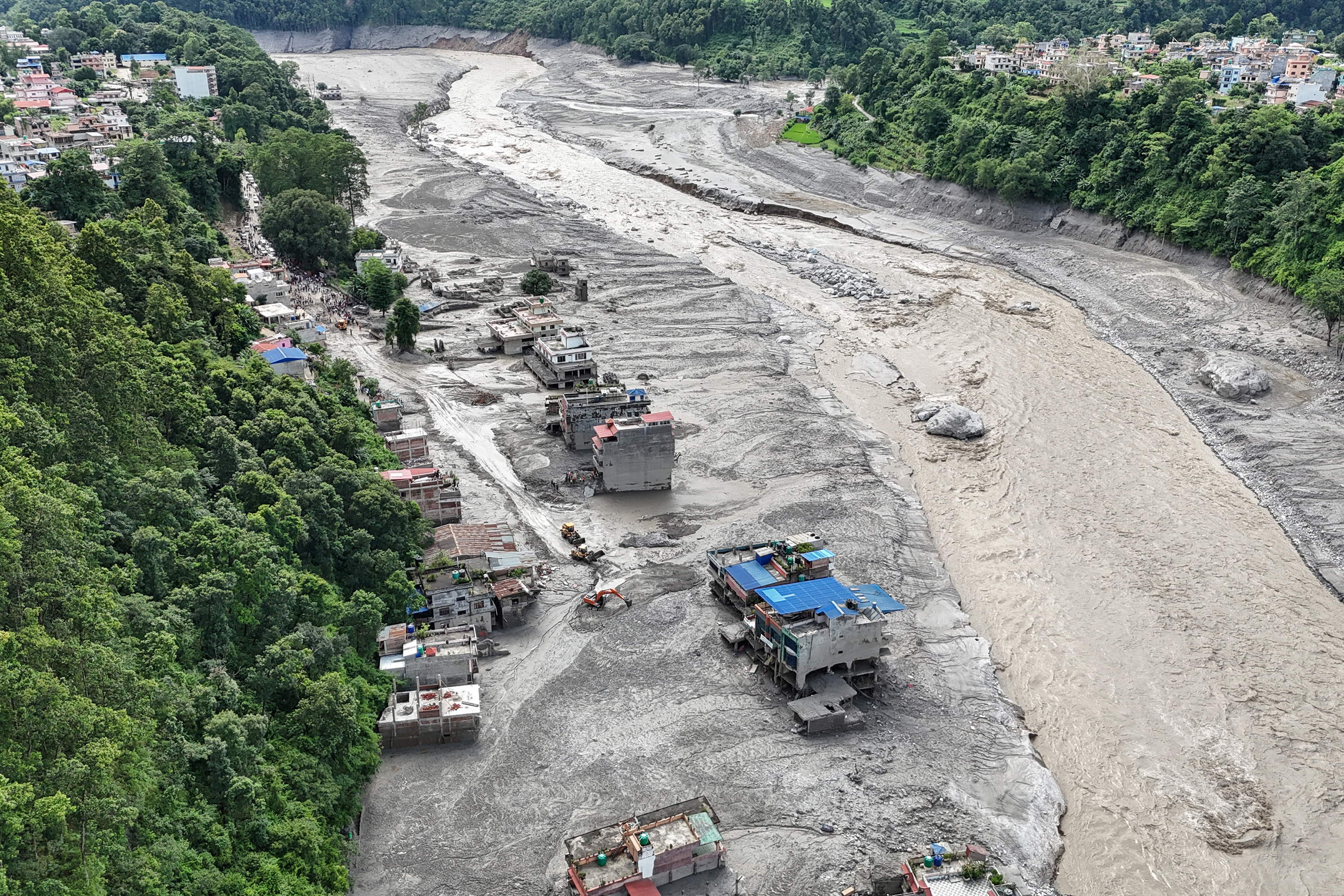 Houses lying deluged in sludge after flash floods at Trishuli in Nepal, Aug. 27, 2026 - AFP