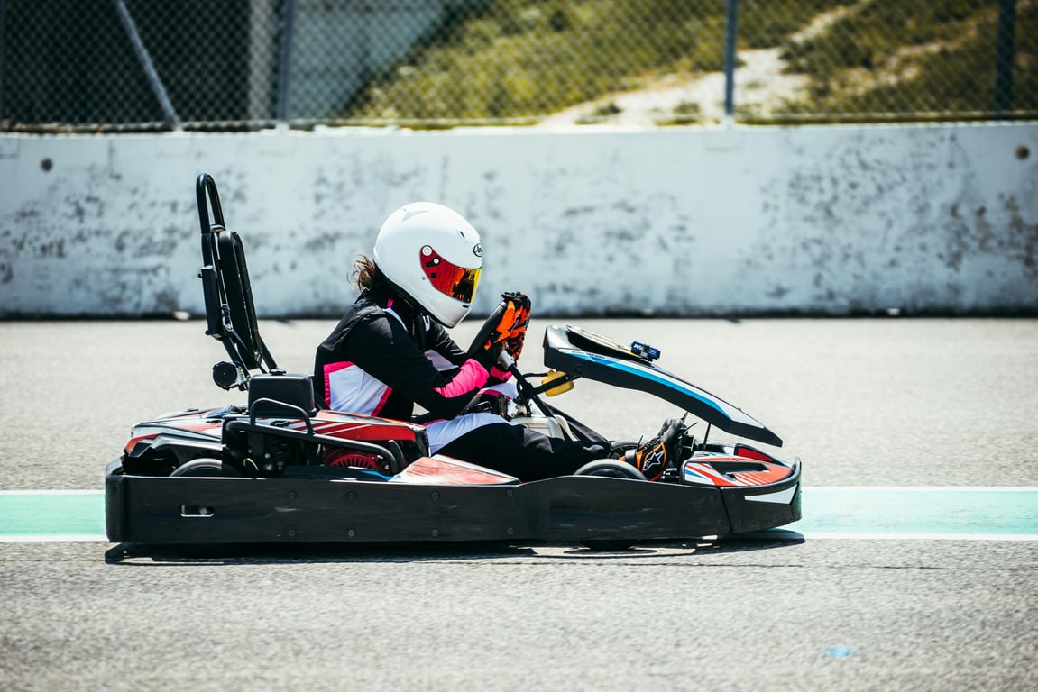 A person driving a go-kart on a race track in Misano, Italy.