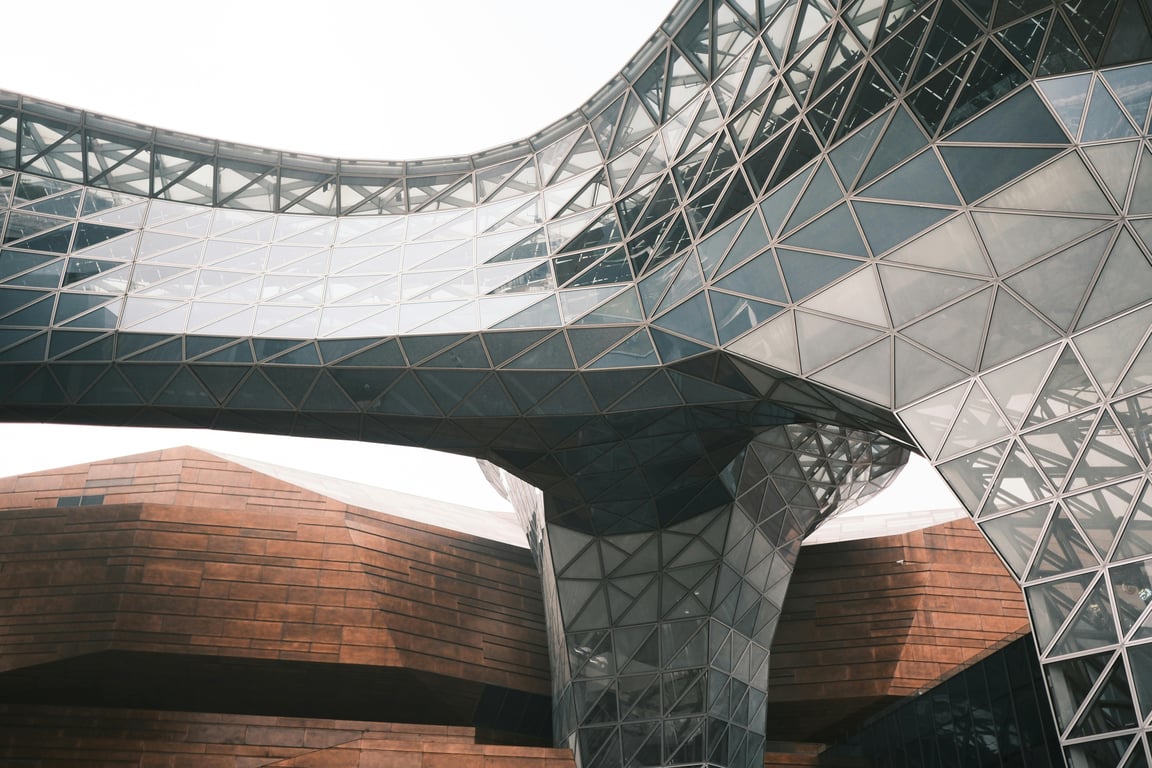 Captured view of the World Expo Museum's glass and steel structure in Shanghai's modern architectural style.