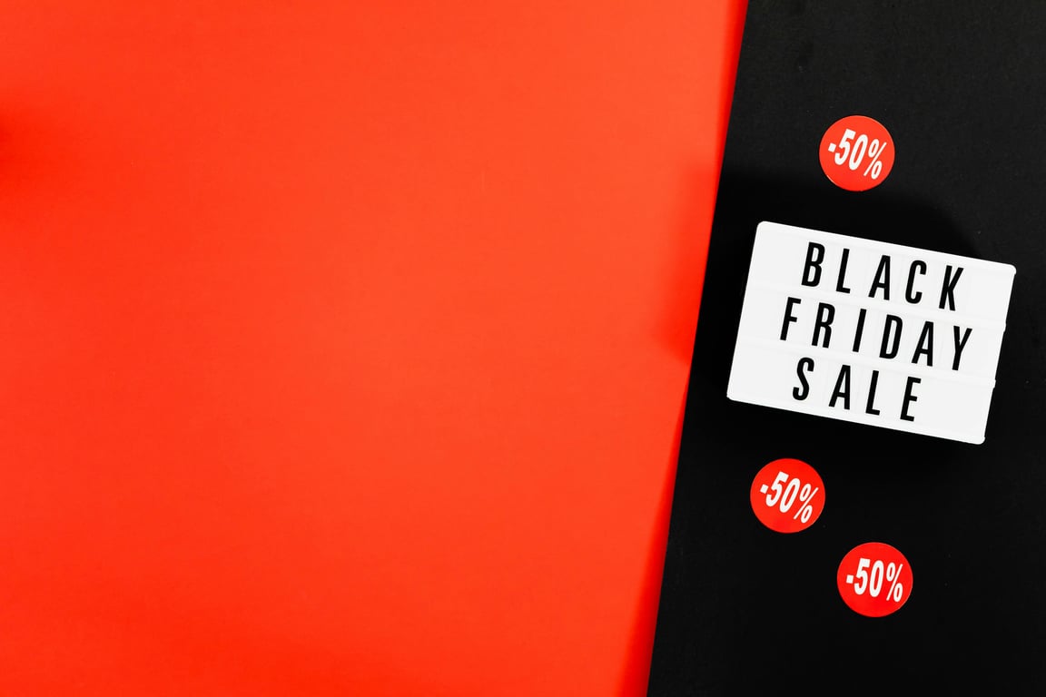 Black Friday sale advertisement with bold red background and discount signs.