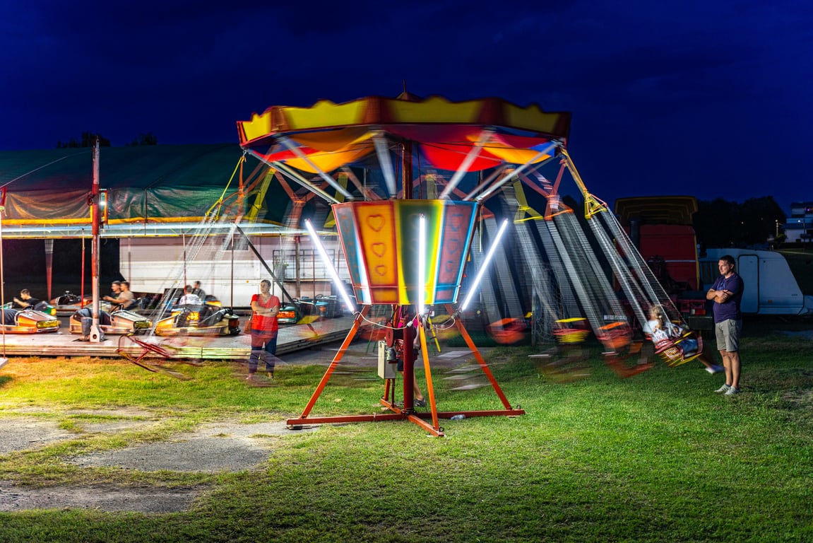 Colorful carousel at a night carnival in Garešnica, Croatia, capturing the fun and excitement.