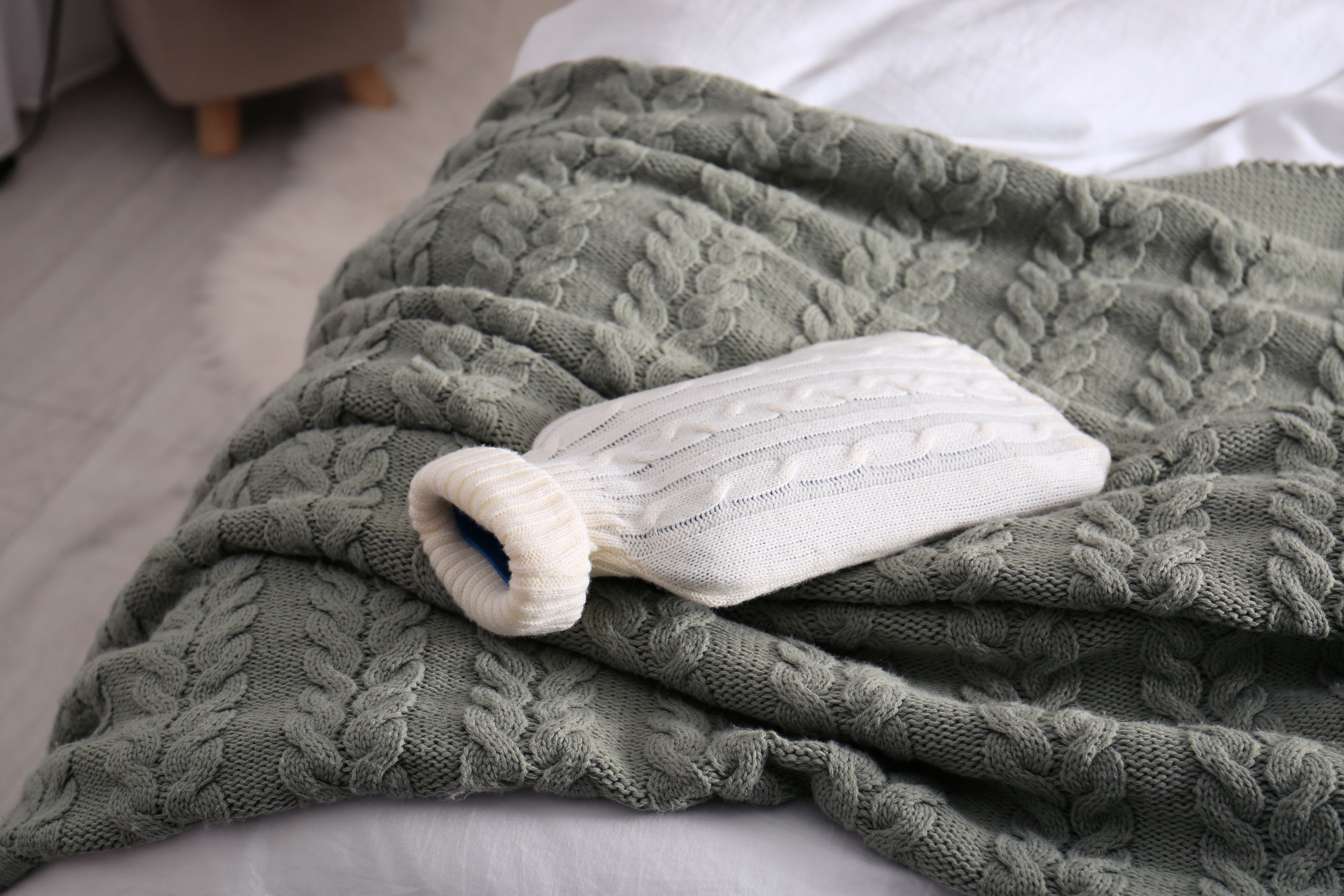 Hot water bottle on a knitted blanket