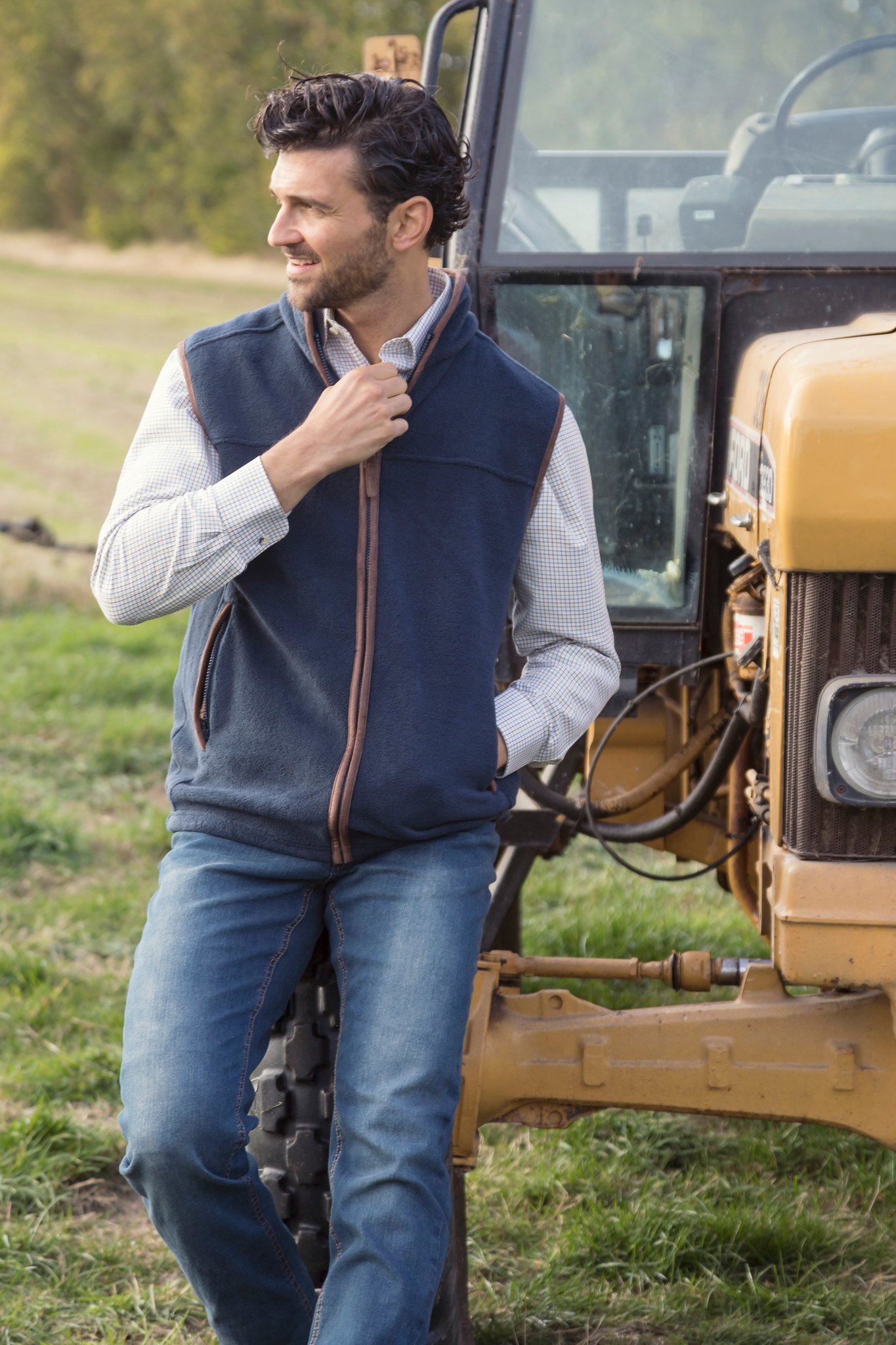 Man wearing a fleece gilet with a shirt below.
