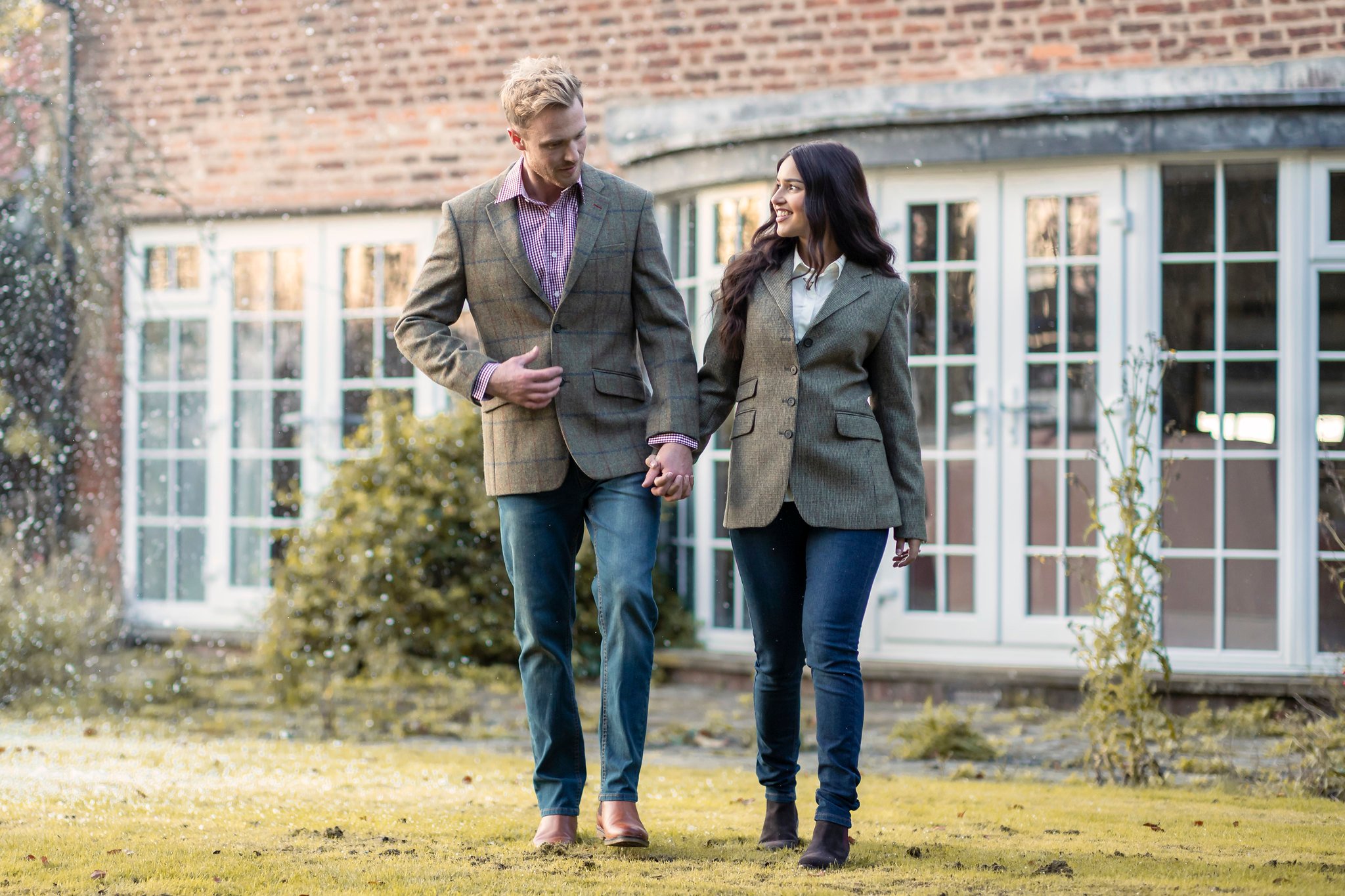 Couple in tweed blazers and jeans