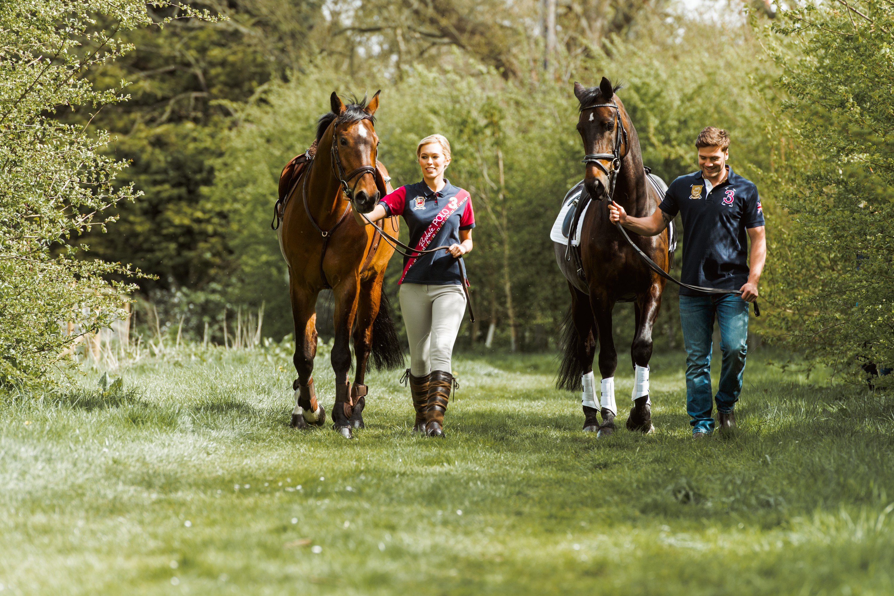 Equestrian couple on a walk with horses