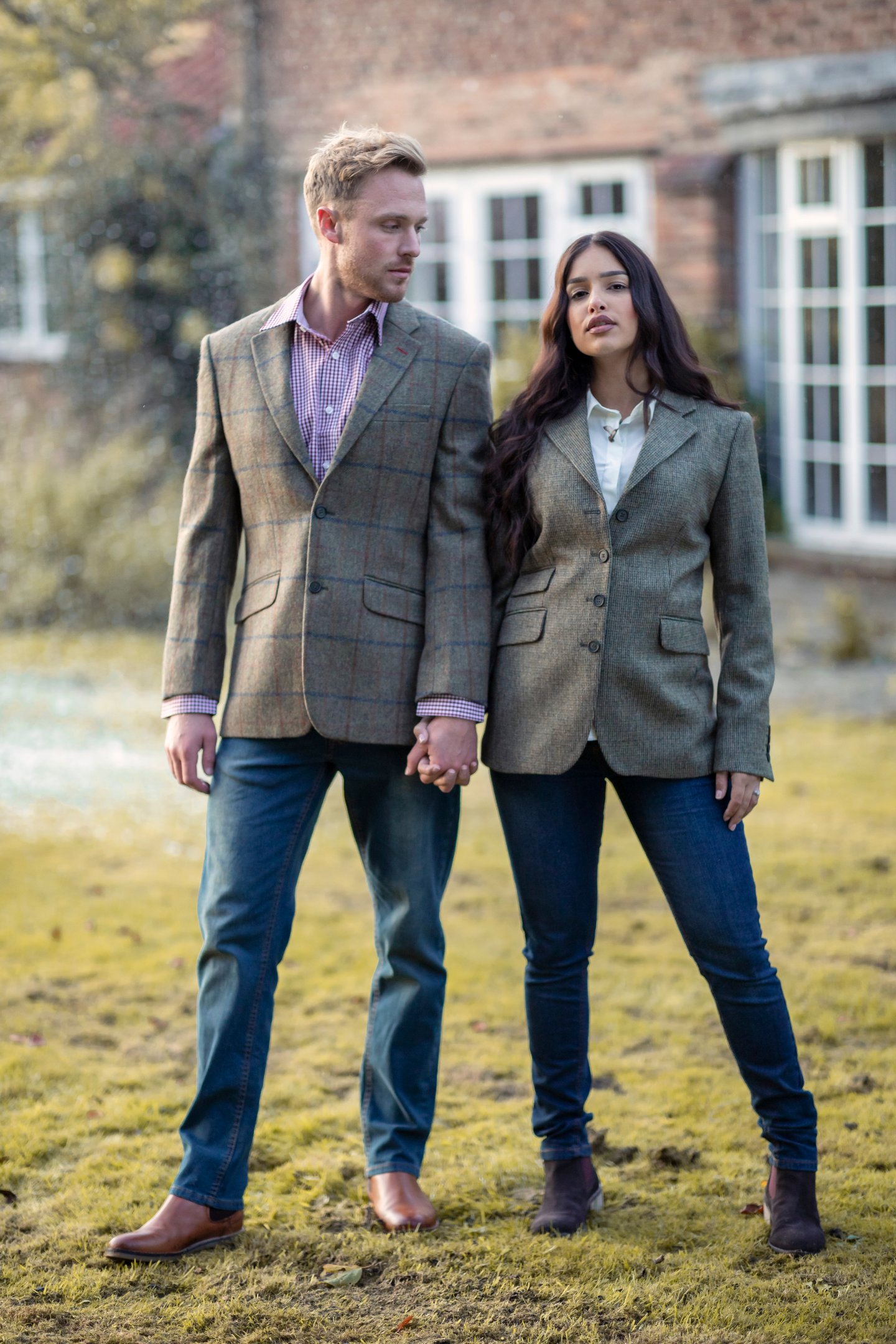Couple wearing blazers and jeans