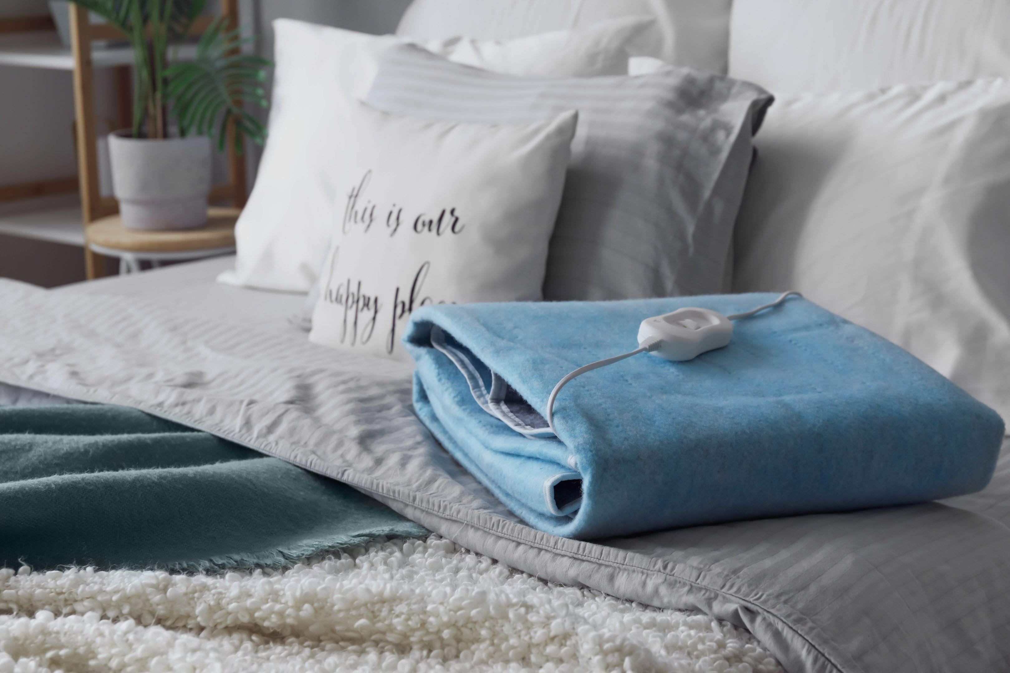 Electric heat pad on a bed