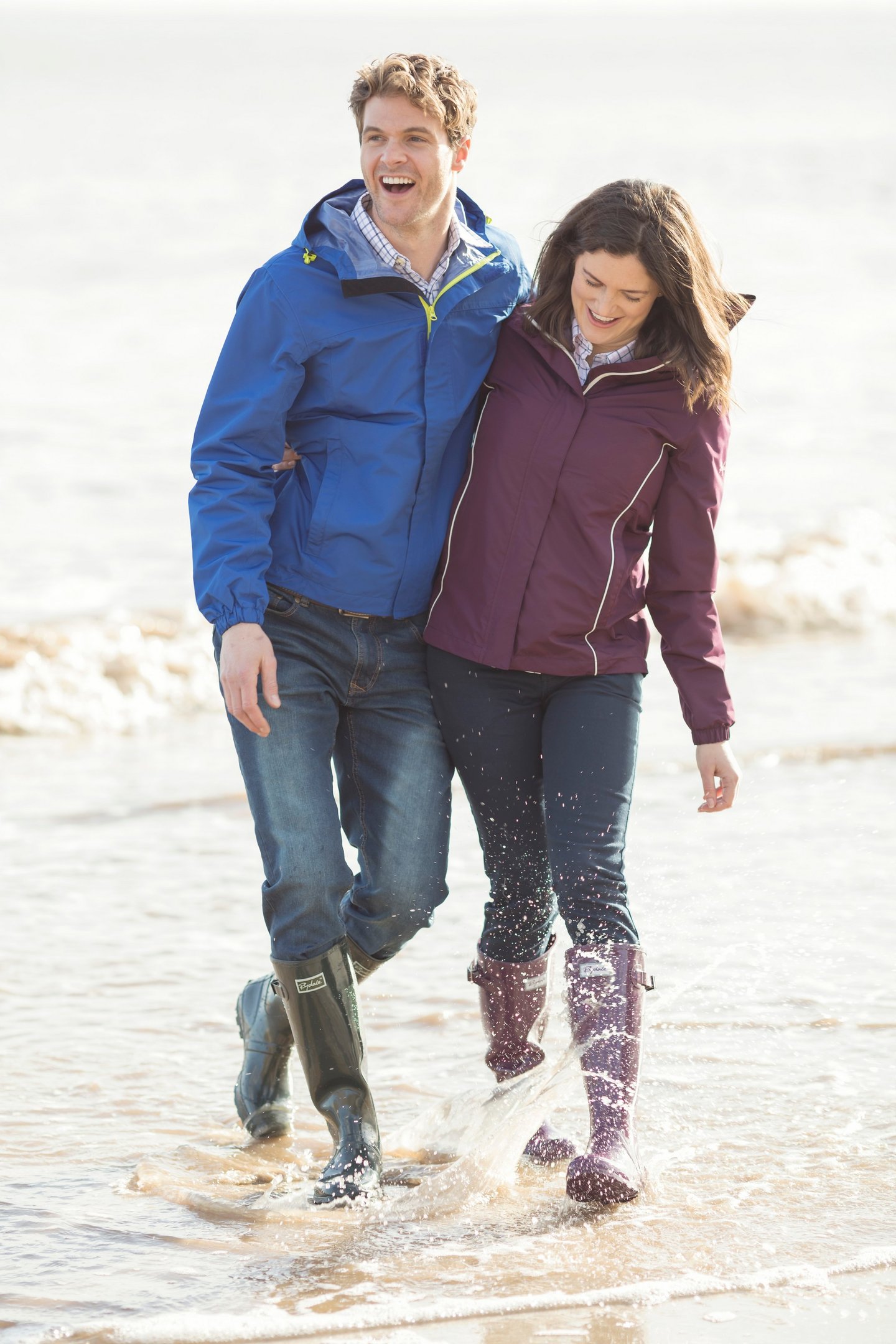 Couple wearing wellies and waterproof jackets