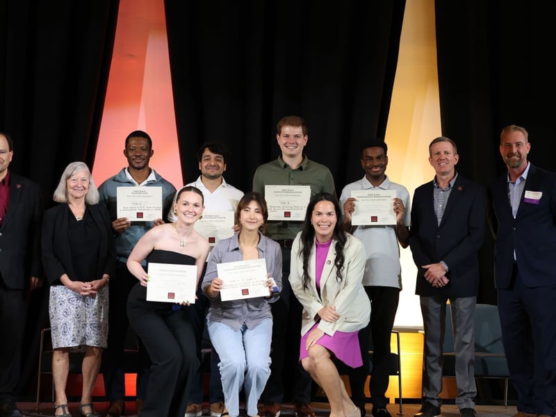 Student award recipients and event leaders gather for a group photo during the TXST STEM Conference, celebrating research excellence and student achievement.
