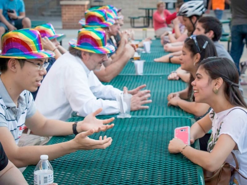 Attendees converse with scientists from the University of Nebraska and across the country during a “scientist speed-dating” activity at Science Night Live! in the Lincoln Railyard.