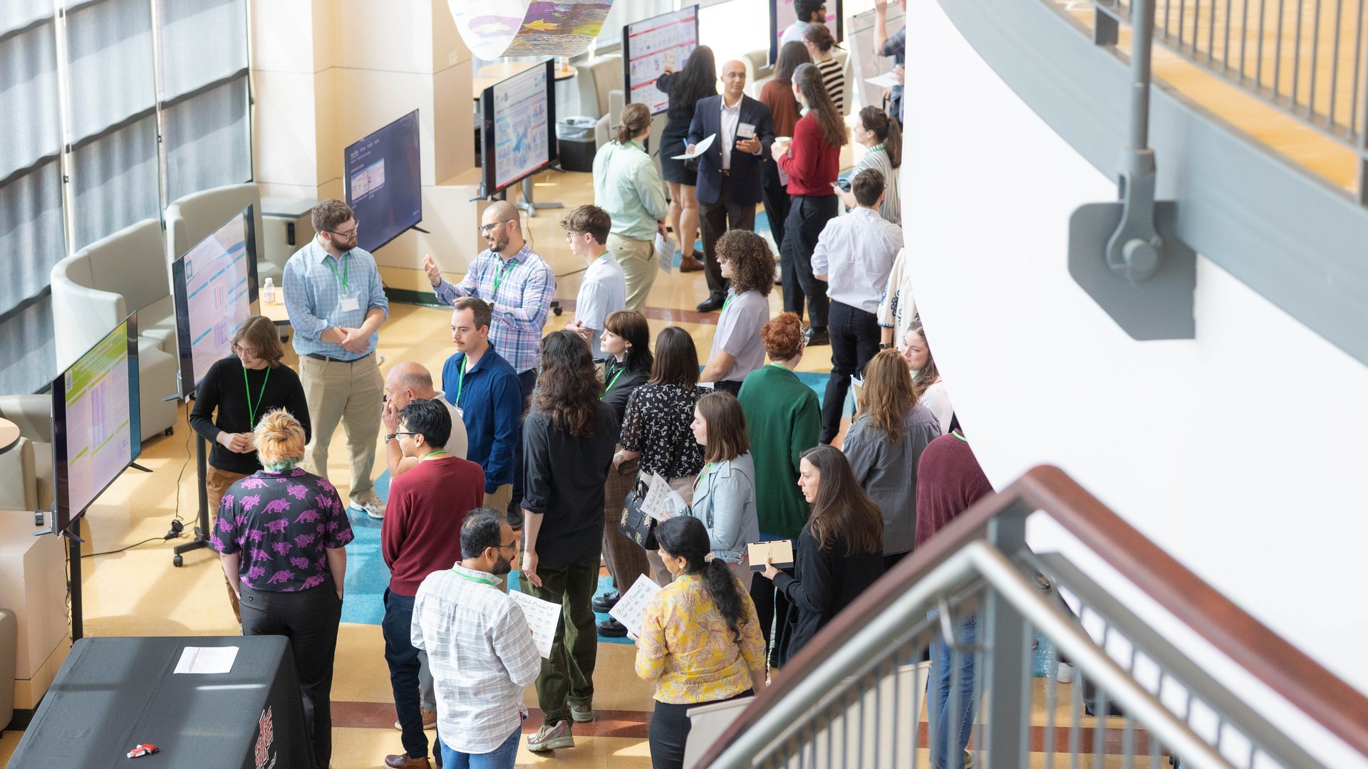Attendees view research posters and connect with presenters during the 2026 Biotechnology Symposium at NorthWest Arkansas Community College.