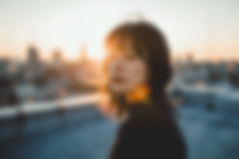 Golden hour rooftop portrait photography prompt - Blurred AI generated image using Nano Banana Pro prompt