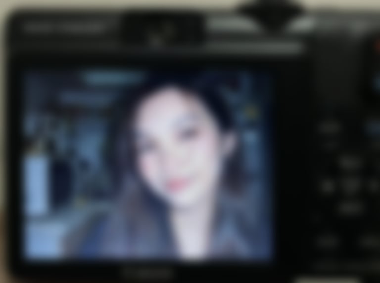 Compact Digital Camera Screen Snapshot of a Young Woman - Blurred AI generated image using Nano Banana Pro prompt