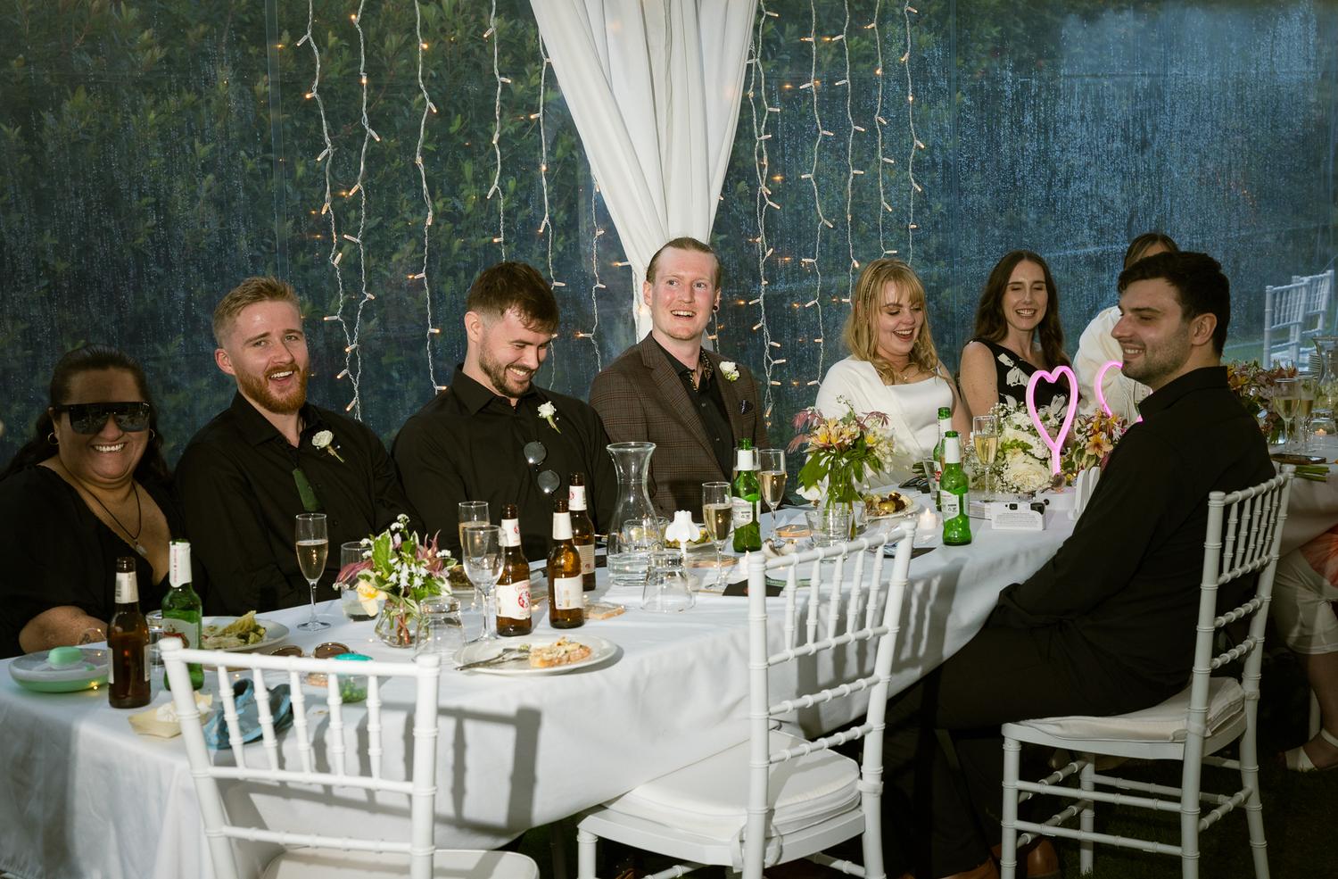 Guests at the reception table in the marquee