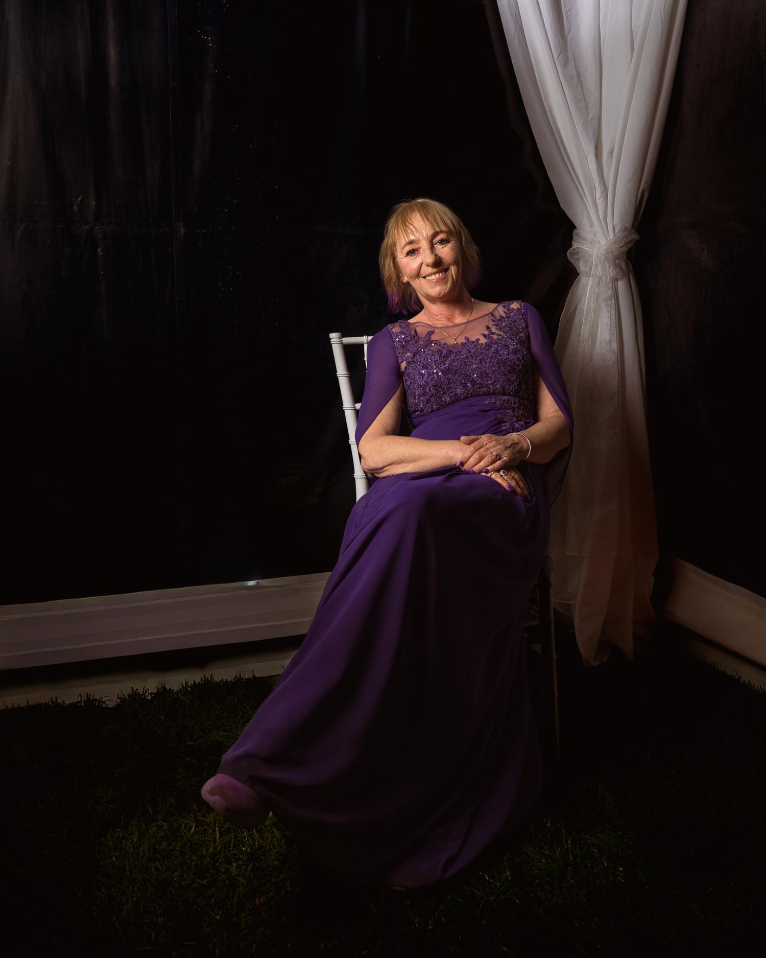 A guest in a purple gown for an evening portrait