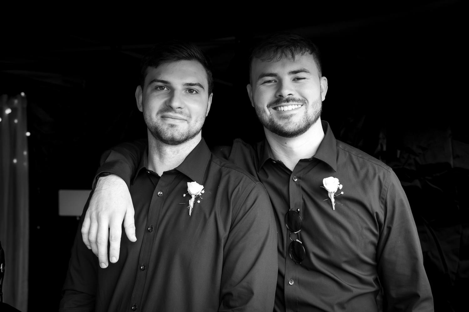 Black and white photo of two groomsmen