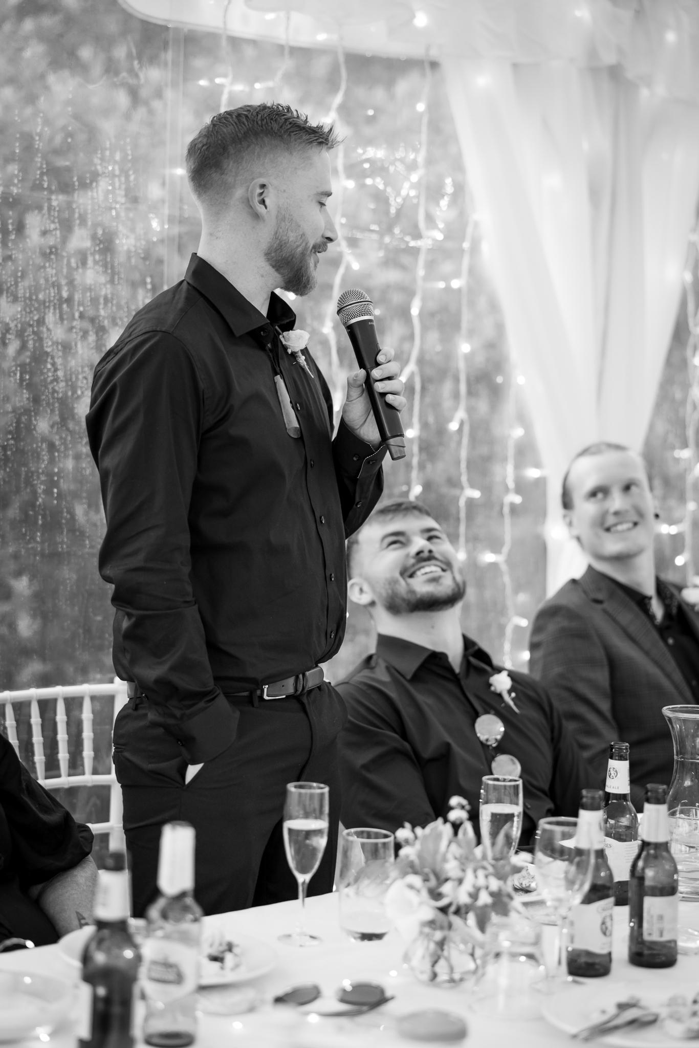 A groomsman gives a speech