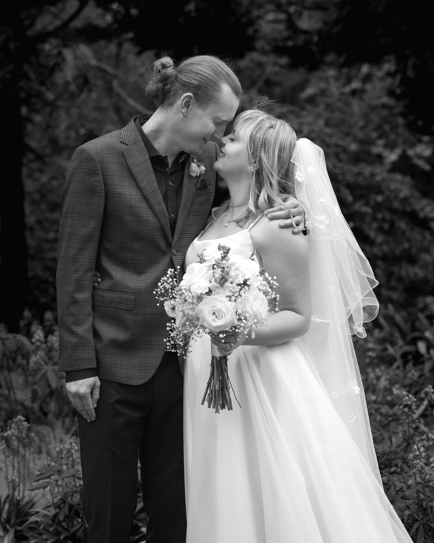 Black and white photo of Shannon and Connor kissing