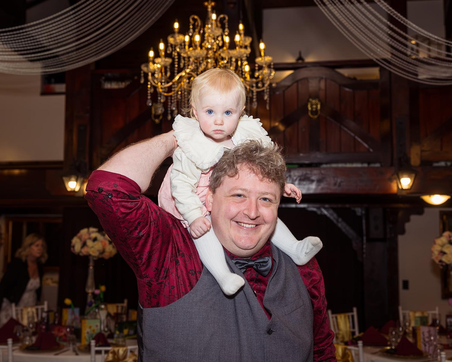 A man is holding a baby
