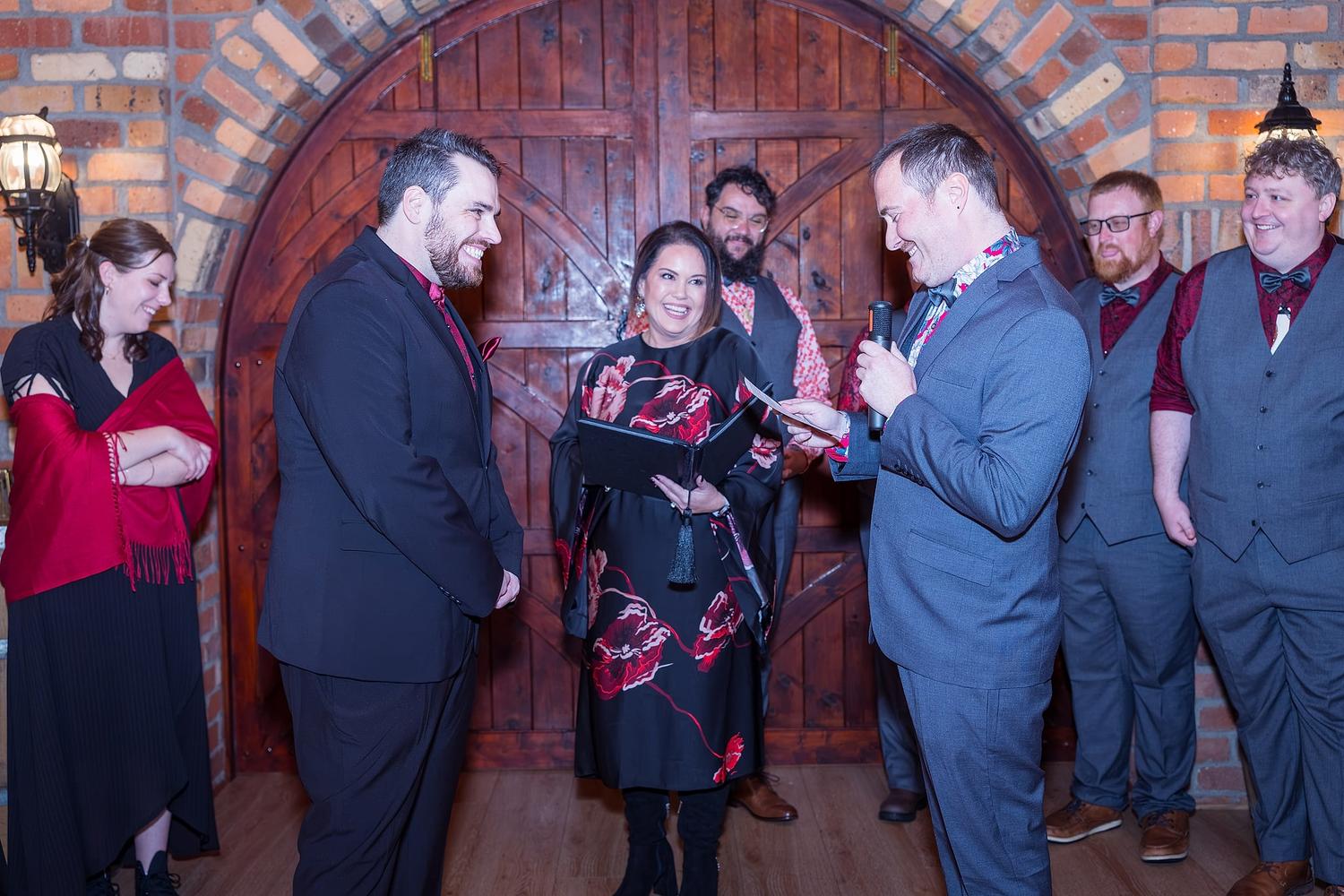 Two people are getting married in front of a group of guests