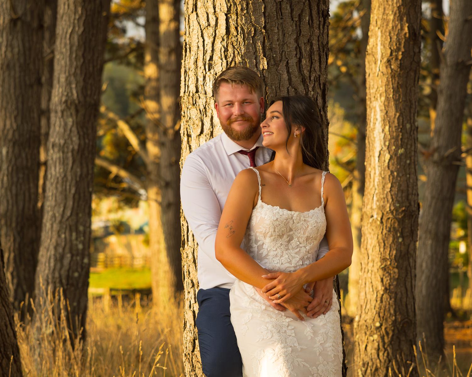 Tay and Jesse among the trees at golden hour