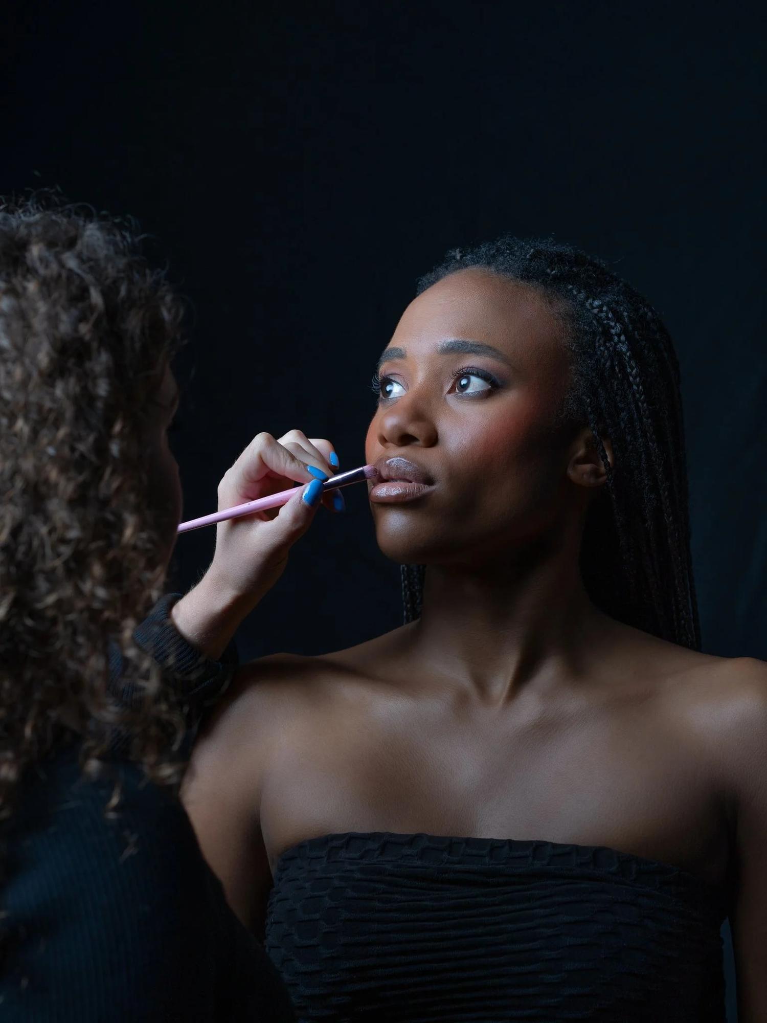 Ty has her makeup applied before the shoot