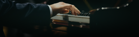 A performer at the keys during a recording session