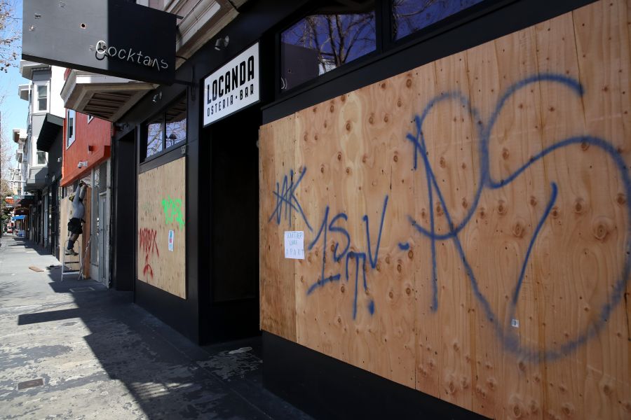 <who>Photo Credit: Getty Images</who>Many San Francisco businesses are boarding up their windows while closed to discourage looters.
