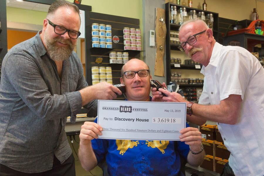 Jerome Abraham receives a cheque last spring from the Okanagan Beard Festivalk