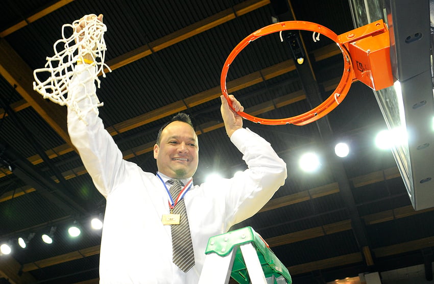 <who>Photo Credit: Lorne White/KelownaNow.com </who>Owls' coach Harry Parmar with a symbol of B.C. high school basketball supremacy.