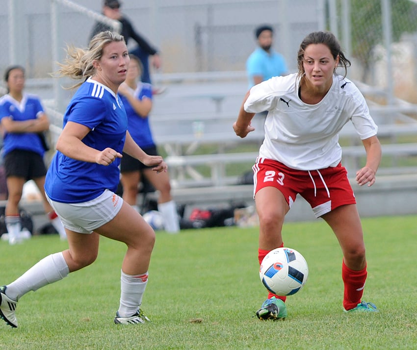 <who>Photo Credit: Lorne White/KelownaNow </who>Jillian Schochter, right, of the Peacock Sheridan Group goes on the offence against Royal Star's Vanessa Zilkie.