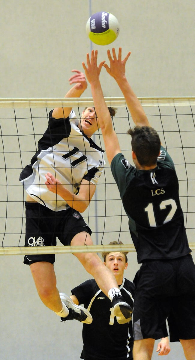 Bergren Van Lent leaps high to hit for a point against Langley Christian.