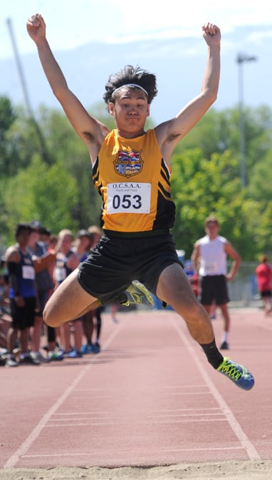 <who>Photo Credit: Lorne White/KelownaNow </who>Nathan Tonogai of KSS leaps to Valley's long jump title.