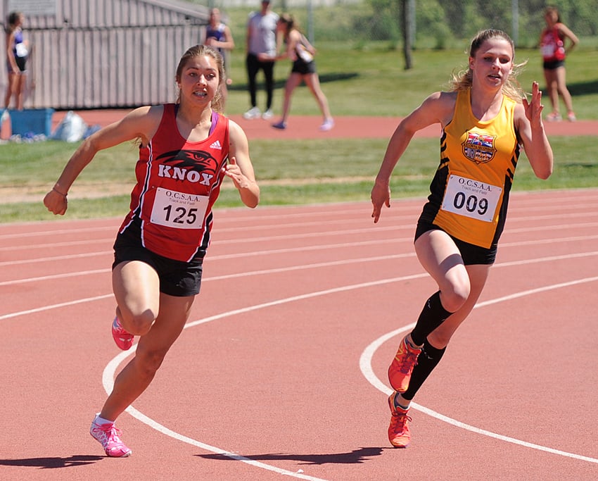 <who>Photo Credit: Lorne White/KelownaNow </who>Haley Wright, left, of Dr. Knox and Bryn Walsh of KSS battle it out in the 200 metres. Walsh took first and Wright was second in the junior race.