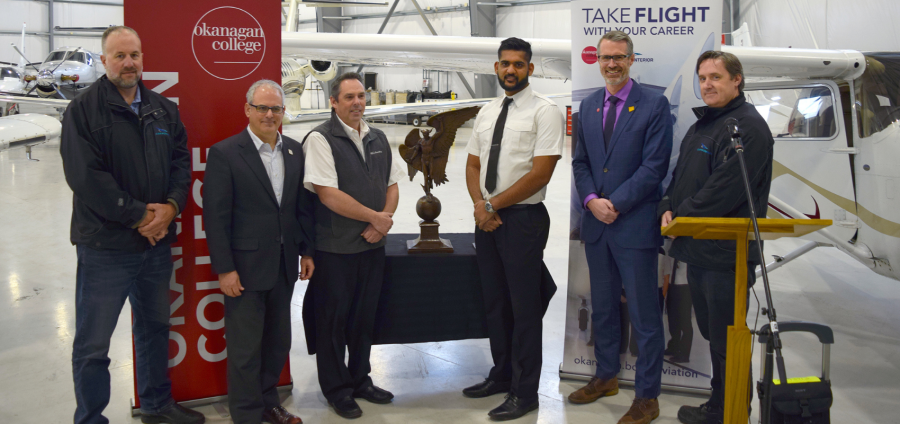 Harmeet Garg (in white, third from right) is presented with his Webster Trophy.