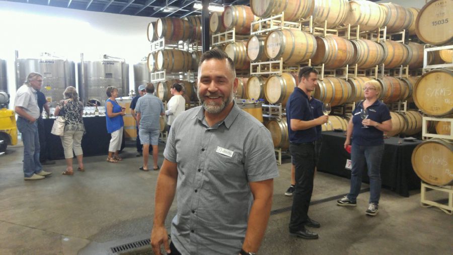 Trevor Allen, the assistant general manager at Township 7 Winery, was all smiles Friday as the winery held a grand re-opening celebration.