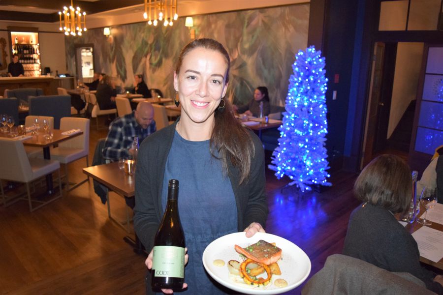 </who>Elizabeth Markulin, a sommelier at The Restaurant at The Naramata Inn, brings out the Code 2020 Pinot Noir from Okanagan Falls with the steelhead trout and confit potatoes.