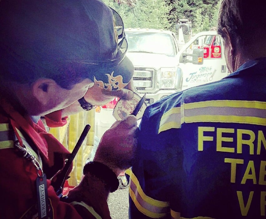 <who>Photo Credit: Joe McCulloch, 150 Fire Department /Sicamous Fire Department</who> Some of the heroes who fought the fire cut off their patches from their uniforms.