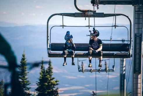 </who>Chairlifts deliver sightseers, hikers and bikers to the top of the mountain at Silver Star for the summer season.