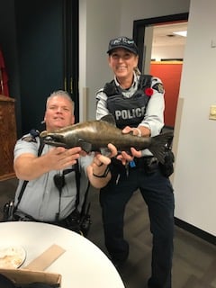 <who>Photo Credit: Penticton RCMP</who> Cpl Don Wrigglesworth and Cst Liz Van Erte show off their haul of one bronze salmon