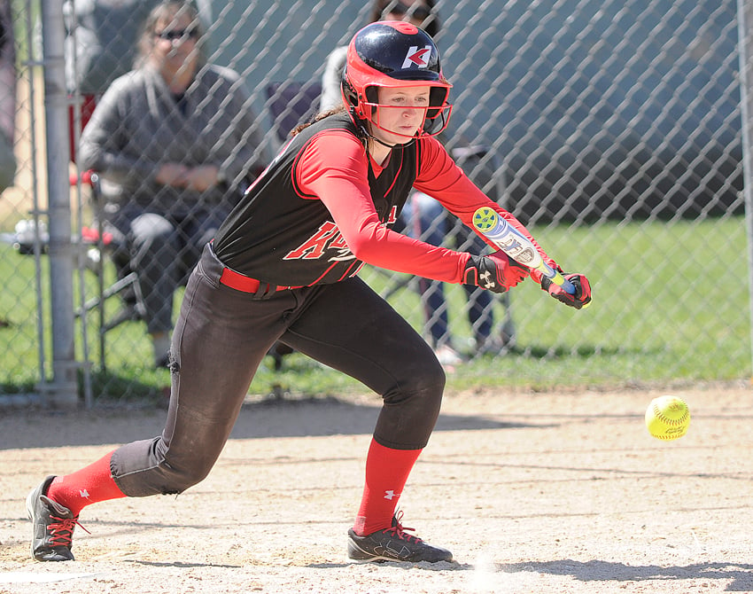 <who>Photo Credit: Lorne White/KelownaNow </who>Emily Elsom lays down a bunt in the Kelowna Heat's round-robin game against the South Delta Invaders.
