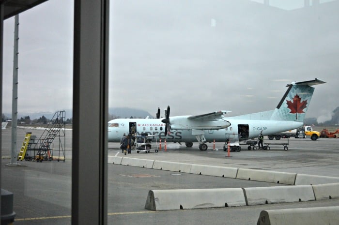 <who> Photo Credit: KamloopsBCNow </who> Passengers board a plane at the Kamloops Airport.