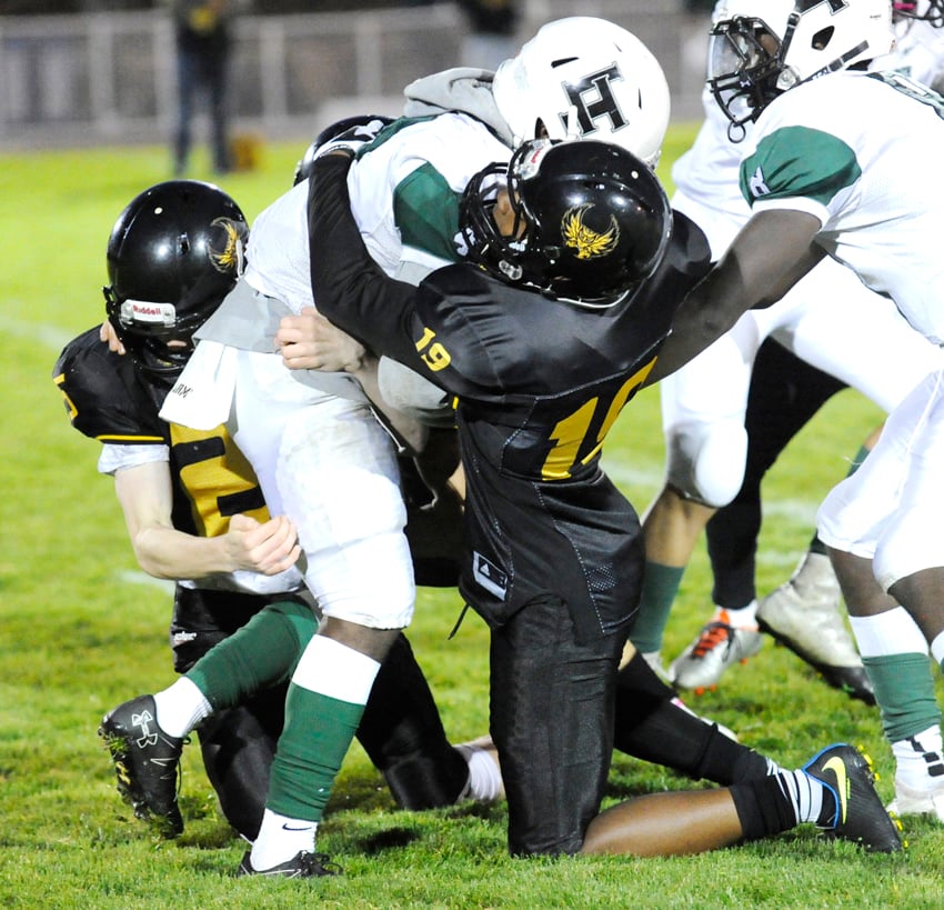 Nathan Gilbert, left, and Jon Haughton of the Owls team up to take down a Panther.
