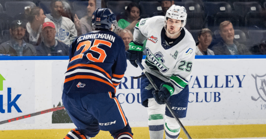 Blazers defenceman Quinn Schmiemann wards off Thunderbirds forward Jared Davidson in action Wednesday night.