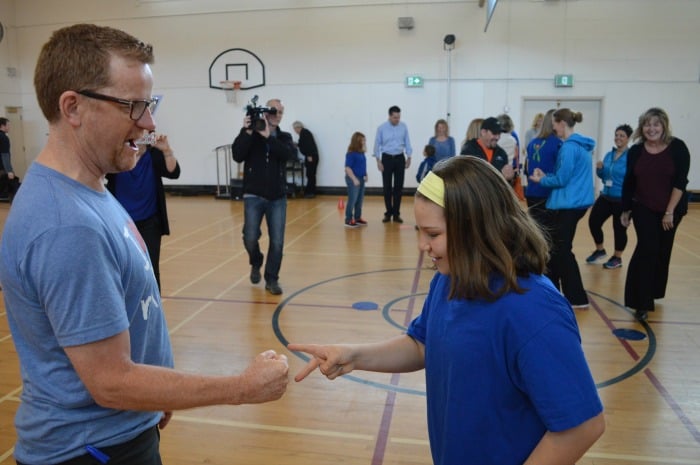 <who> Photo Credit: KamloopsBCNow </who> Lake playing a game of rock-paper-scissors with a MEND participant.