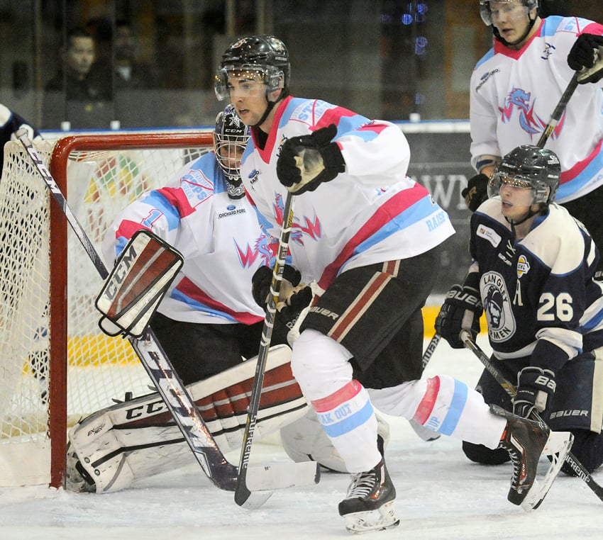 <who>Photo Credit: Lorne White/KelownaNow.com </who>Rylan Yaremko and goaltender Matthew Greenfield defend in the Warriors' end during a Langley powerplay.