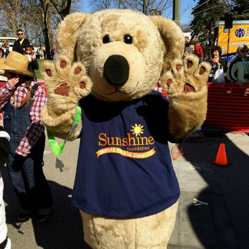 <who> Photo Credit: The Sunshine Foundation of Canada. </who> Sunshine Bear mascot